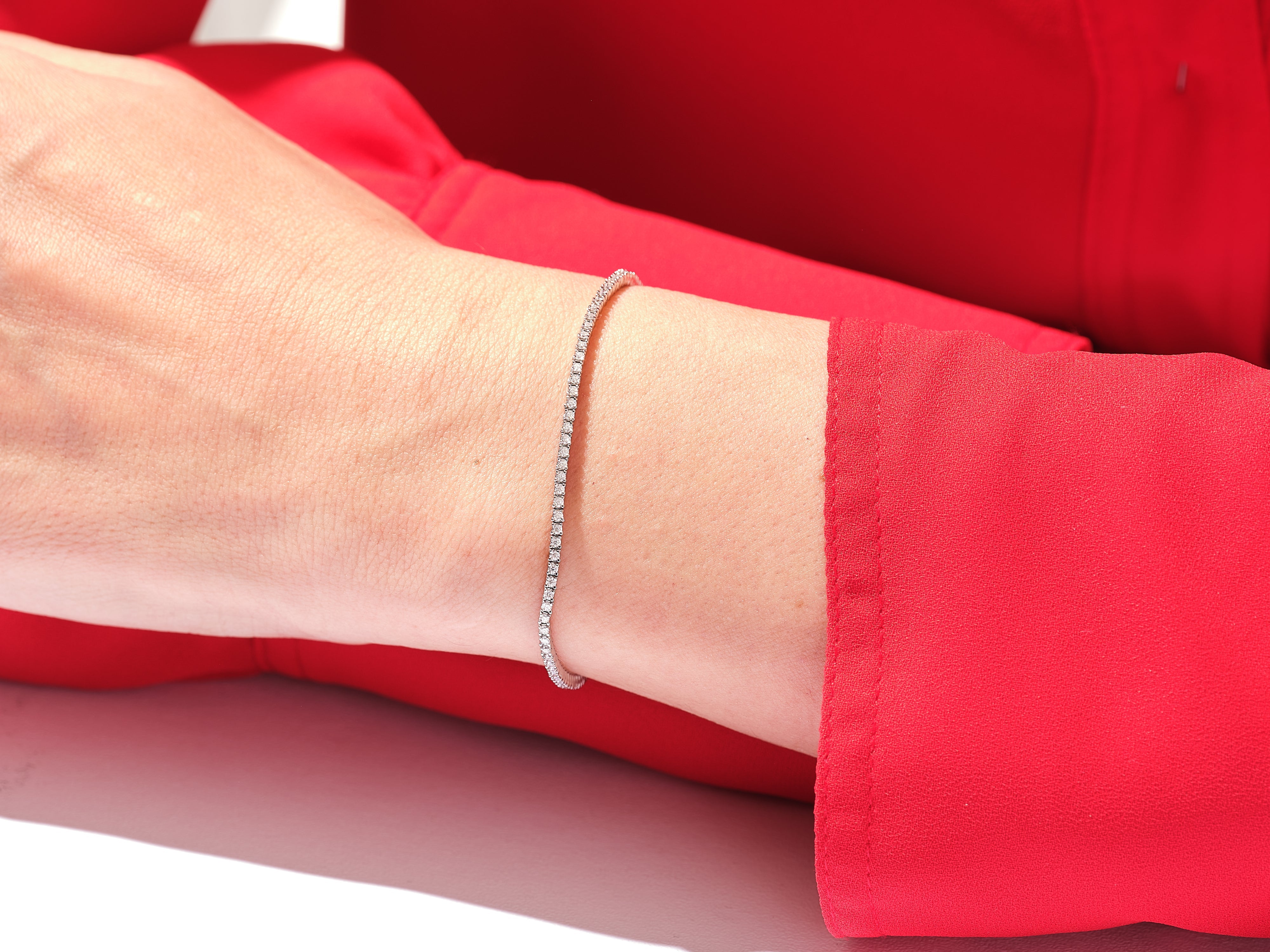 Diamond tennis bracelet on a wrist, jewelry for women