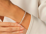 Diamond tennis bracelet on a woman's wrist, jewelry product