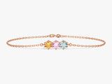 Rose gold bracelet with three colorful gemstone charms