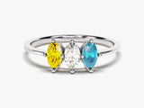 Silver ring with yellow, white, and blue marquise cut gemstones