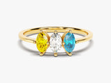 Gold ring with yellow, white, and blue marquise-cut gemstones