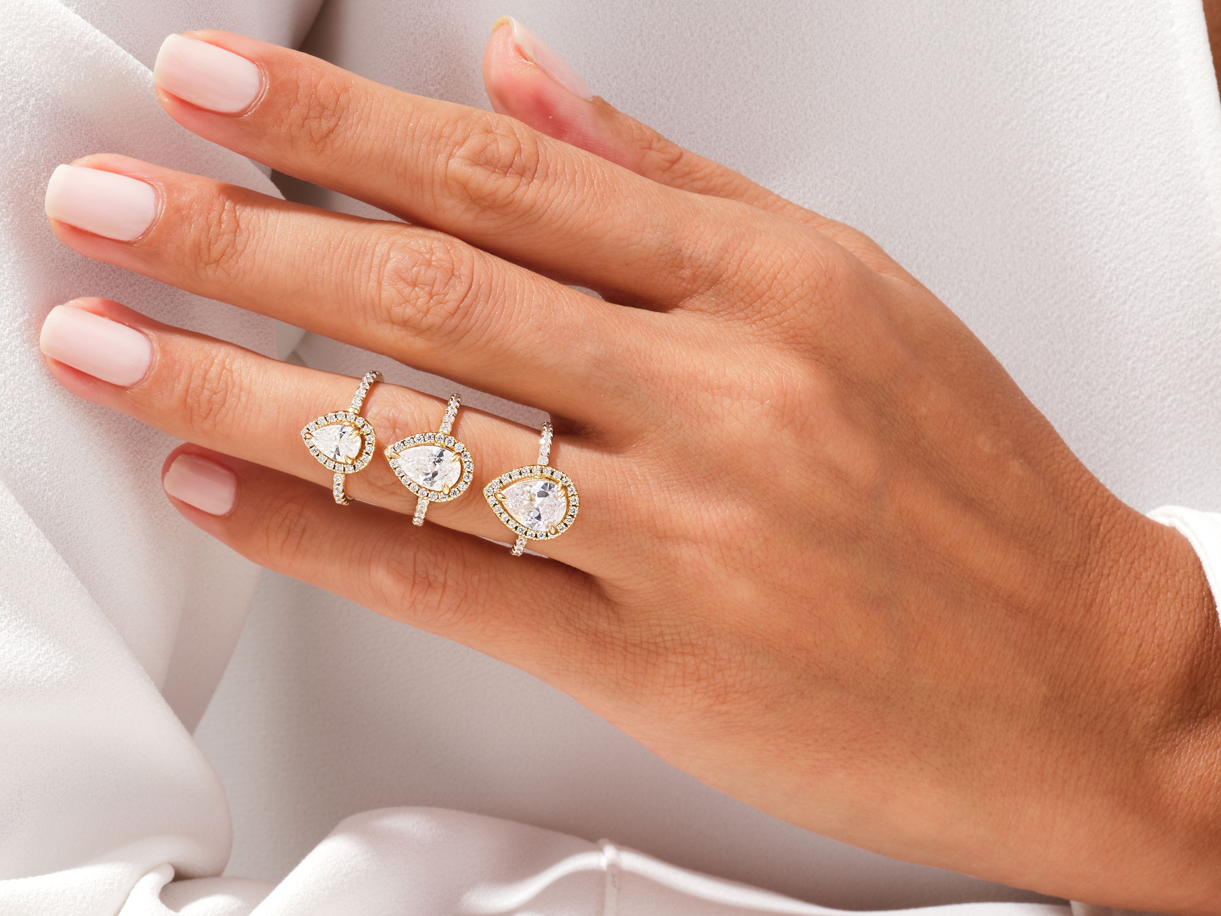 YAN TAŞLI DAMLA KESİM HALO YÜZÜK