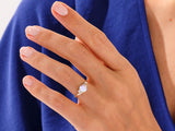 Gold opal ring with diamonds on a woman's hand
