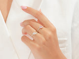 Diamond and pink sapphire rings on a hand, jewelry