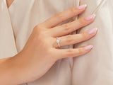 Diamond heart ring on a woman's hand, elegant jewelry