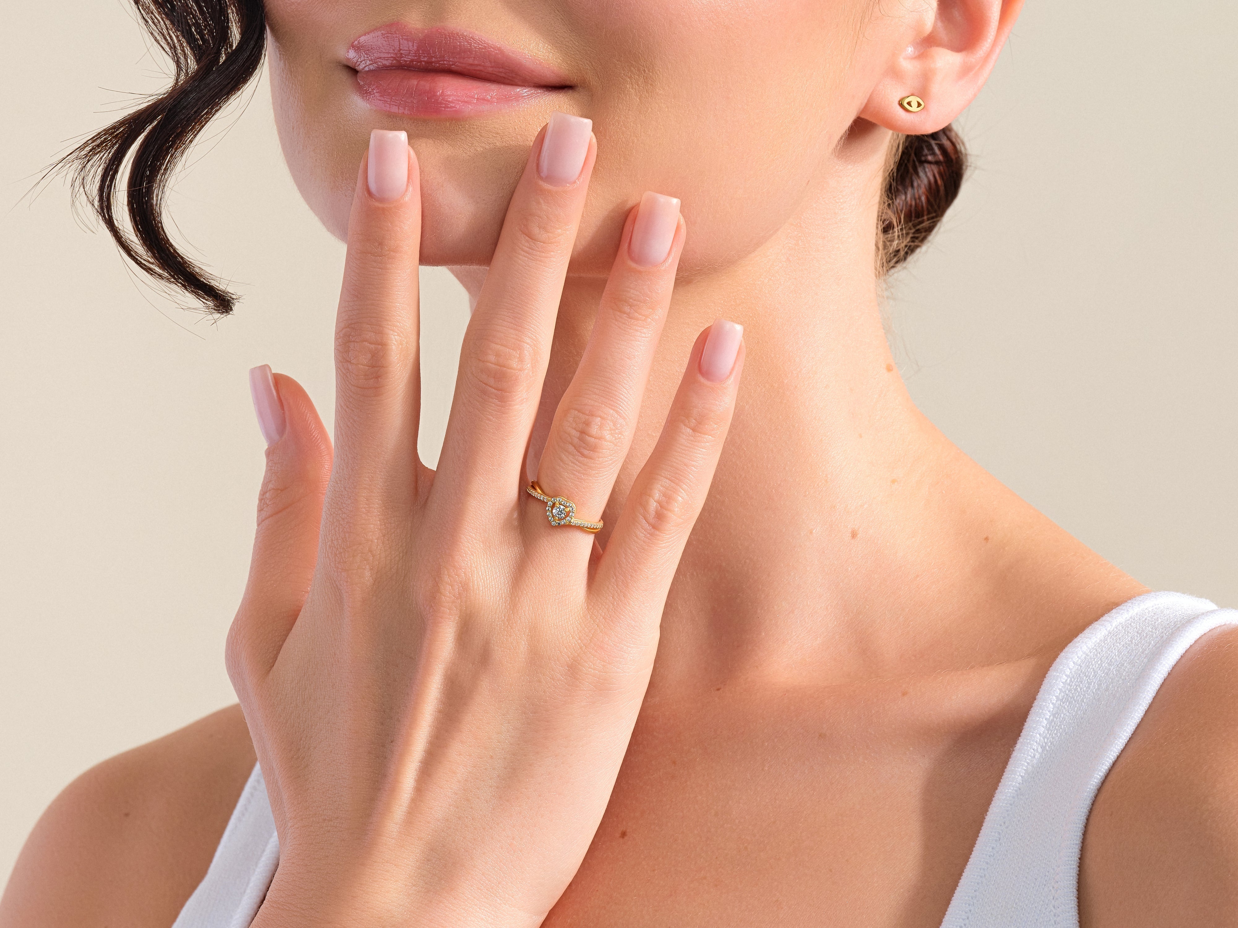 Diamond heart ring and gold stud earrings from jewelry company