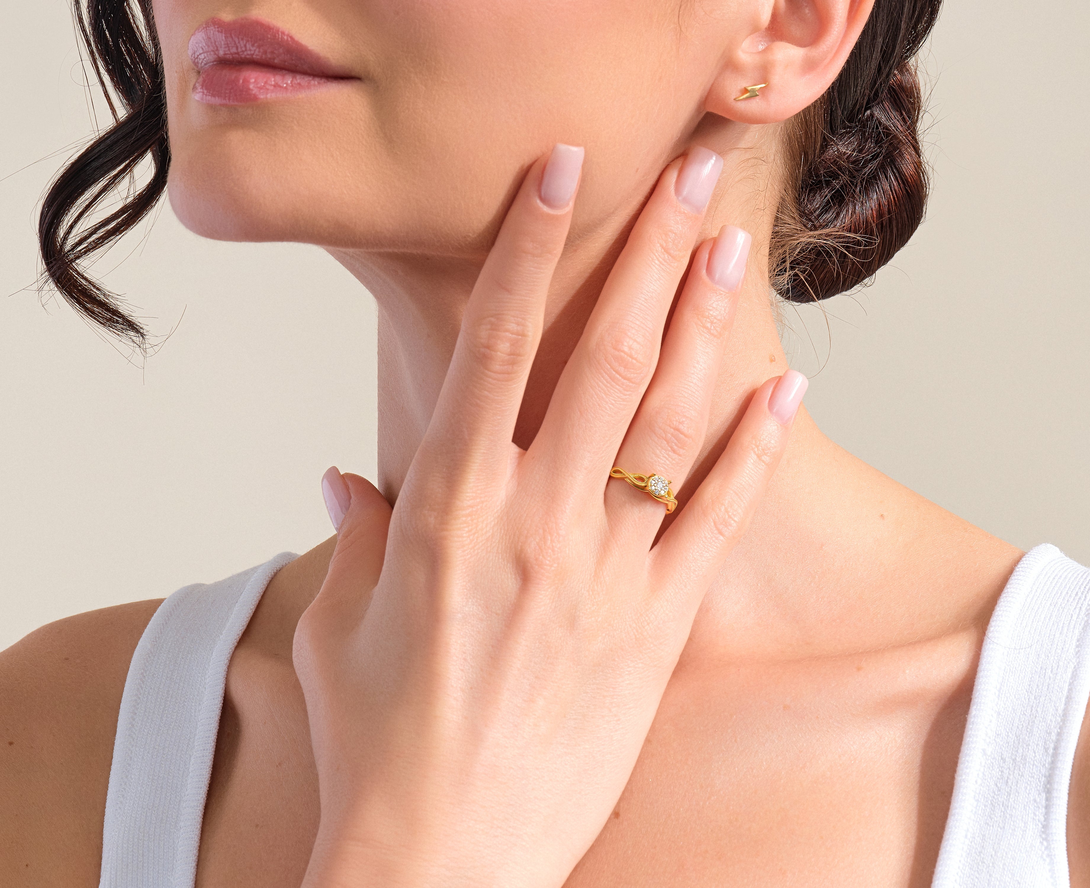 Gold diamond ring and lightning bolt earrings from jewelry brand