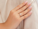 Pink heart diamond ring on a woman's hand