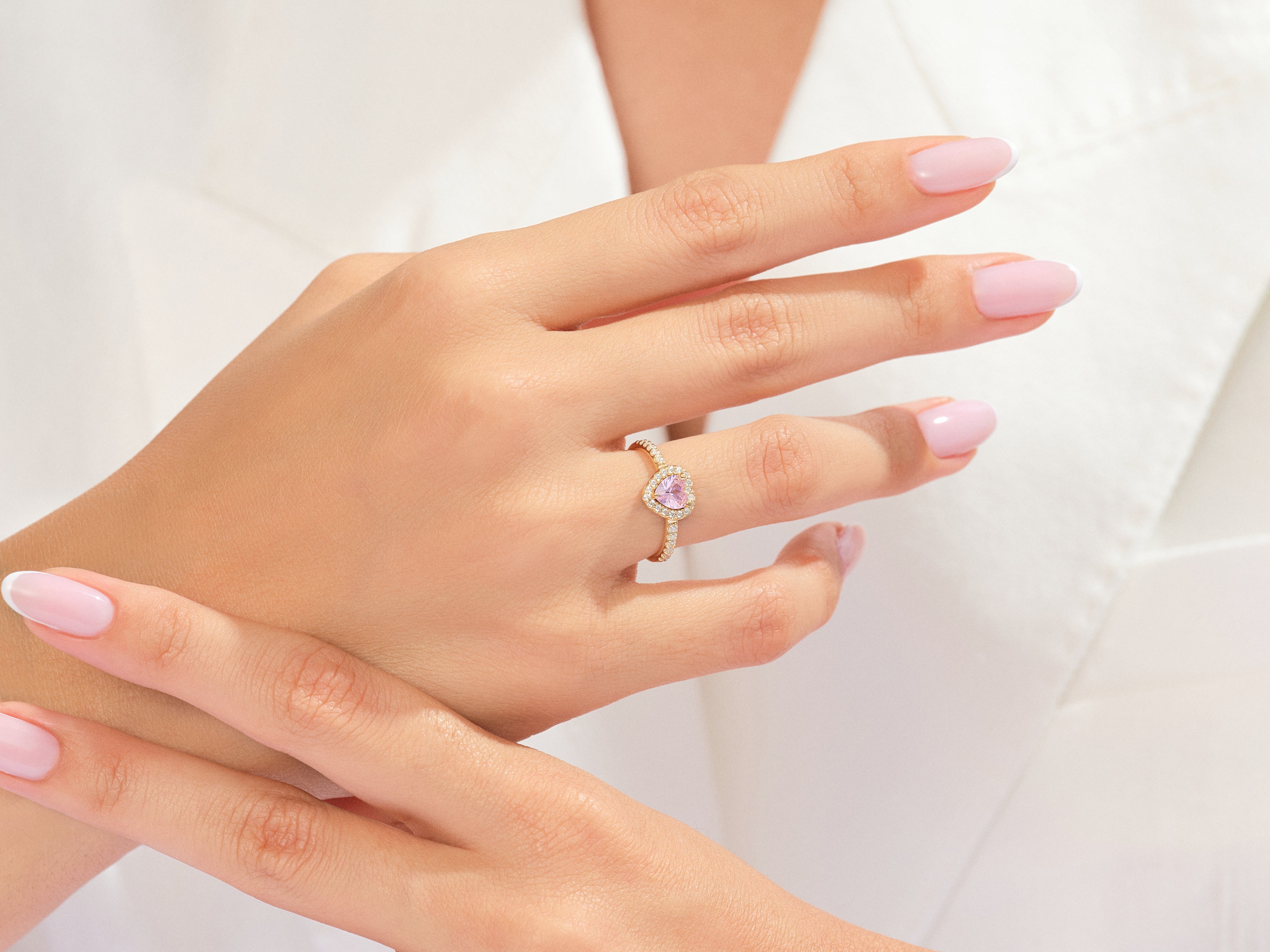 Diamond heart ring on a woman's hand, jewelry photography