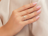 Elegant emerald cut diamond ring on a woman's hand