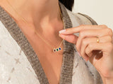 Gold necklace with colorful gemstone pendants, jewelry