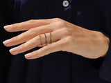 Stackable gemstone rings on a hand, fine jewelry for women